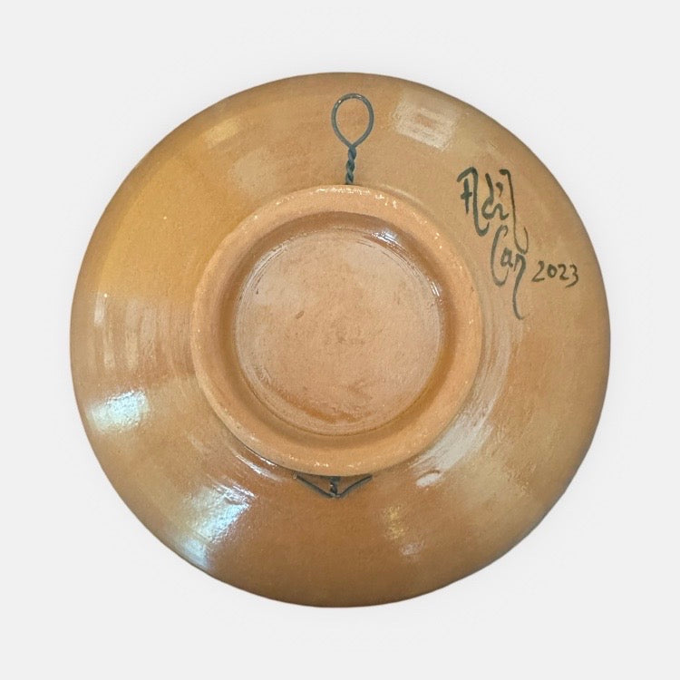 The Voyage Dubai - Hand-painted Iznik ceramic bowl by acclaimed Turkish artist Adil Can Güven. The bowl is painted in a traditional Iznik style featuring a blue and white floral design.