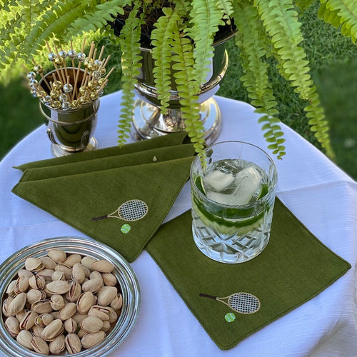 The Voyage Dubai - Overserved Cocktail Napkins in Green   A chic set of cocktail napkins to elevate your post match cocktails. A perfect gift for any tennis aficionado.  Our cocktail napkins are handcrafted from 100% European linen that has been stonewashed and softened giving them a wonderful, luxurious feel. The cocktail napkins come beautifully presented making for the perfect gift.