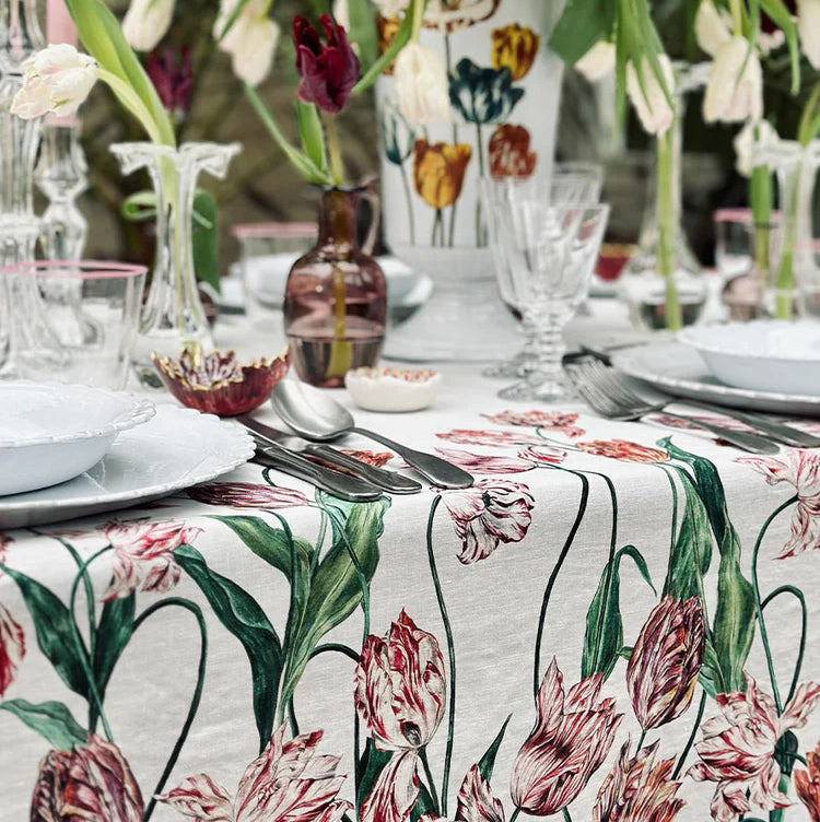 Tablecloth in Red & Pink
Tulipmania takes hold all over again… With rich, complex colours and elaborately curved and crimped petals that give each flower a distinctive character, this tablecloth explores the intriguing nature of the Tulip, a flower that has continued to beguile with its beauty,throughout the centuries.