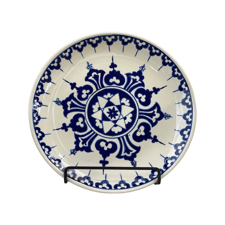 The Voyage Dubai - One of a kind, hand-painted Iznik ceramic plate from Turkey featuring a bold blue and white geometric design.