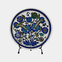 The Voyage Dubai - A set of beautiful hand-painted Iznik ceramic plates from Turkey.  The trio of plates, featuring intricate floral designs in a classic blue and white palette, make a stunning addition to any home.