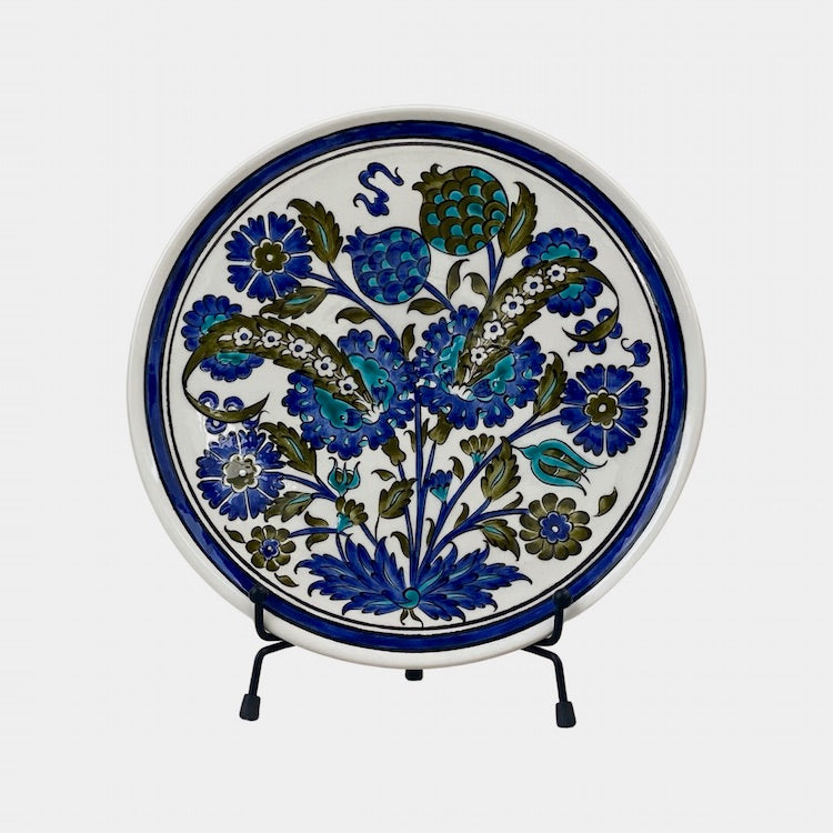 The Voyage Dubai - A set of beautiful hand-painted Iznik ceramic plates from Turkey.  The trio of plates, featuring intricate floral designs in a classic blue and white palette, make a stunning addition to any home.