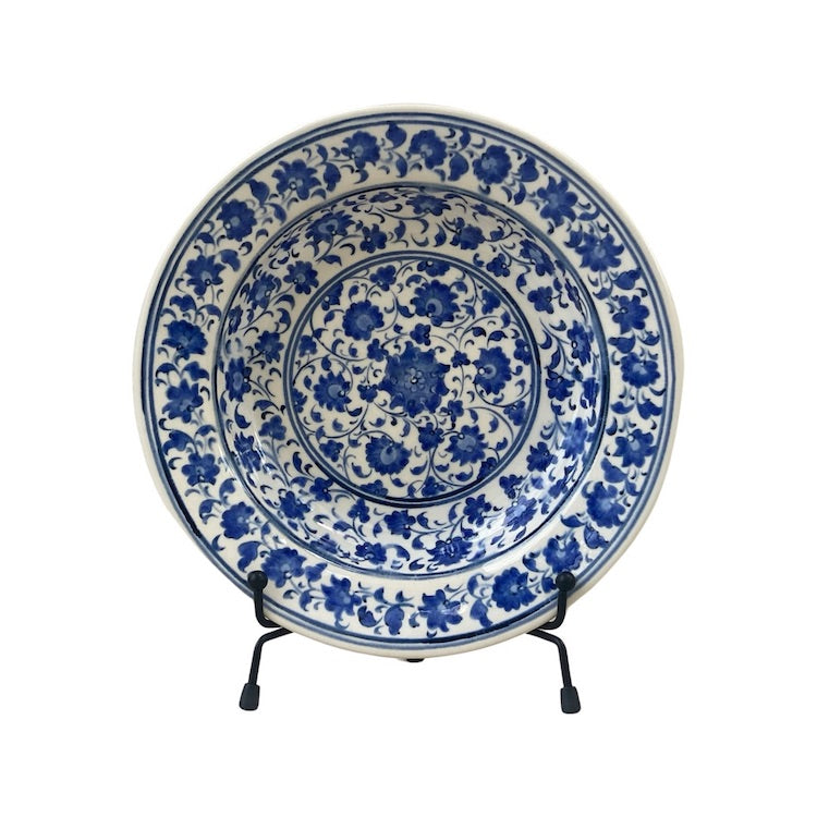 The Voyage Dubai - A set of beautiful hand-painted Iznik ceramic plates from Turkey.  The trio of plates, featuring intricate floral designs in a classic blue and white palette, make a stunning addition to any home.