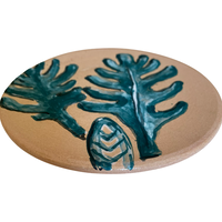 The Voyage Dubai - The Prickly Pear small saucer plate is a beautiful, hand painted piece, inspired by the Mediterranean landscape. This unique piece is an eye-catching addition to any kitchen, dining room, or living space. Use as a saucer or a lovely display piece to create an interesting vignette.