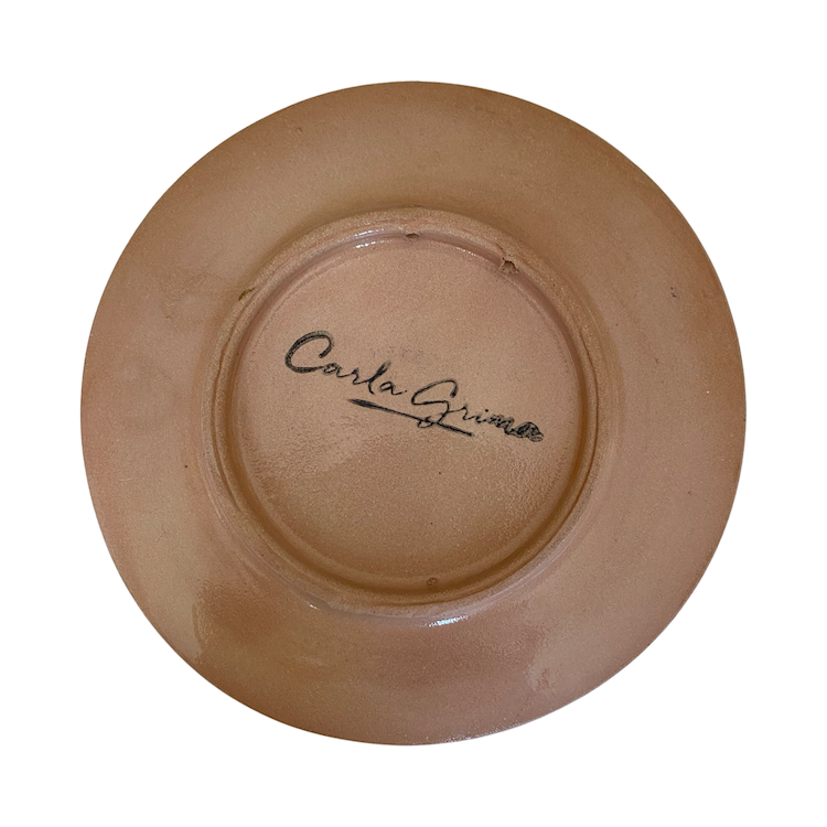 The Voyage Dubai - The Prickly Pear small saucer plate is a beautiful, hand painted piece, inspired by the Mediterranean landscape. This unique piece is an eye-catching addition to any kitchen, dining room, or living space. Use as a saucer or a lovely display piece to create an interesting vignette.