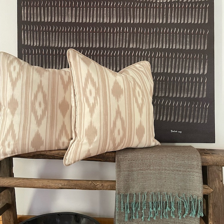 The Voyage Dubai - Mallorcan Ikat cushion in Taupe  A striking accent cushion printed in this traditional geometric motif and finished with taupe piping. The perfect addition to a sofa, armchair or bed.