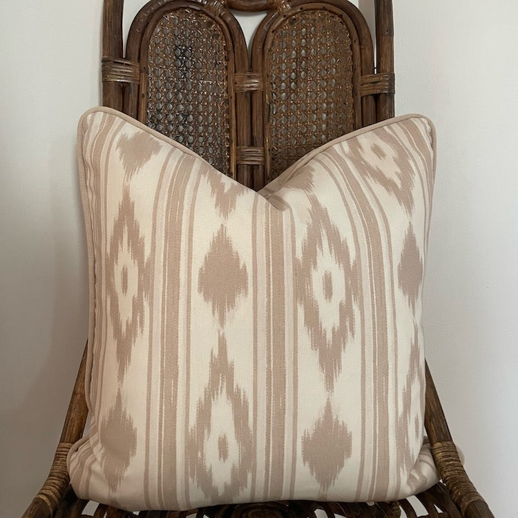 The Voyage Dubai - Mallorcan Ikat cushion in Taupe  A striking accent cushion printed in this traditional geometric motif and finished with taupe piping. The perfect addition to a sofa, armchair or bed.