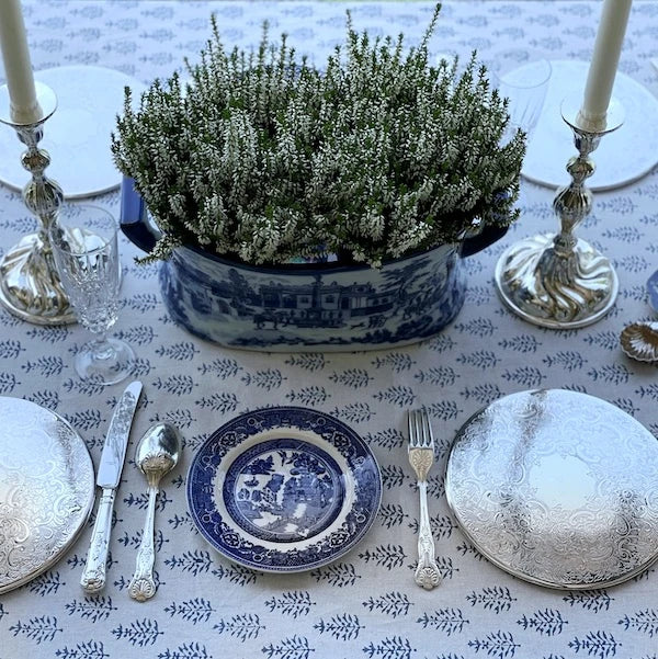 A table setting with silver pieces