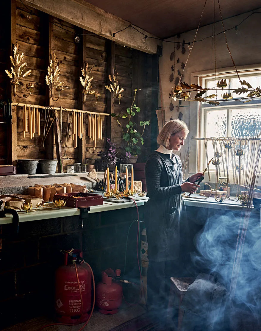 Jess Wheeler hand-crafts brass and bronze sconces and candlesticks in North Wales, drawing on the botanical forms of the Snowdonia landscape.
