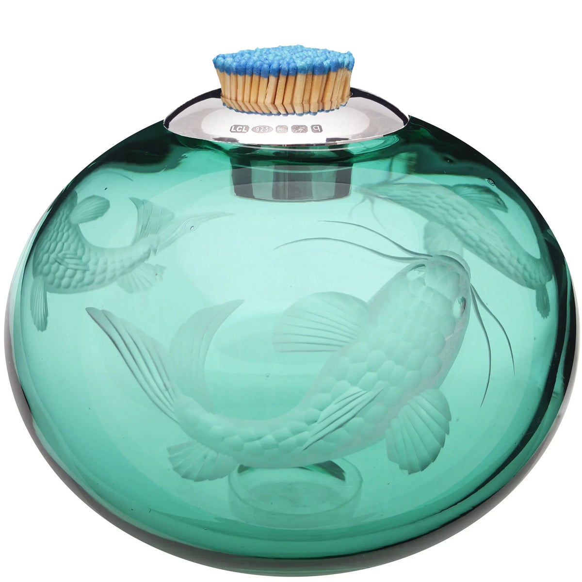 Lucy Cope has designed hand-blown English crystal match strikes for over 30 years, collared in hallmarked sterling silver, made in England. Available at The Voyage Dubai.