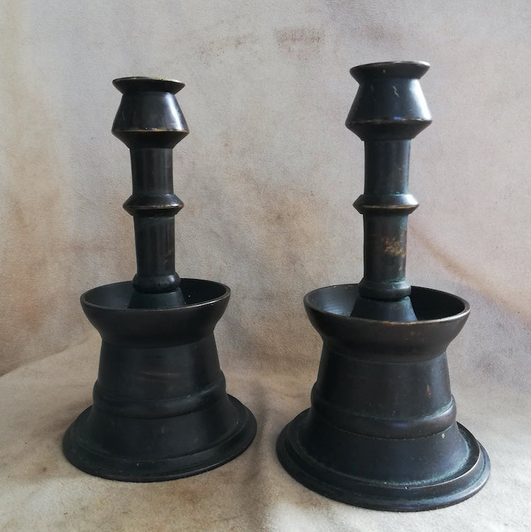 The Voyage Dubai - A pair of vintage, 1960's Ottoman-style candle holders with a lovely patina. The candle holders are made in one piece with a round base and a thin stickholder, hollow in the center. 