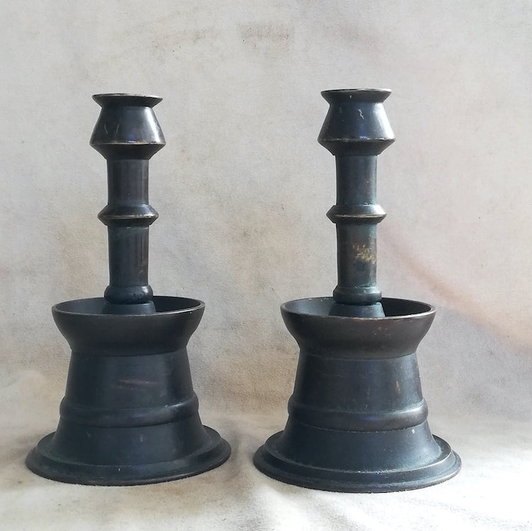 The Voyage Dubai - A pair of vintage, 1960's Ottoman-style candle holders with a lovely patina. The candle holders are made in one piece with a round base and a thin stickholder, hollow in the center. 