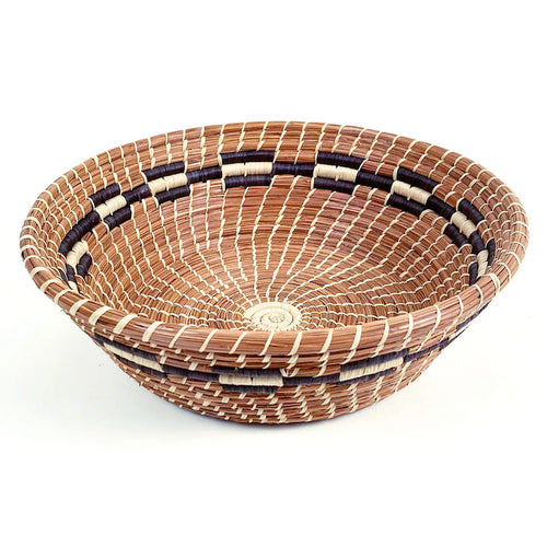 The Voyage Dubai -Mayan Hands Bernarda basket - Perfect as a table centerpiece, bread or fruit bowl or simply as a display piece, the Bernarda basket features intricate raffia stitching on coils of sustainably harvested pine needles