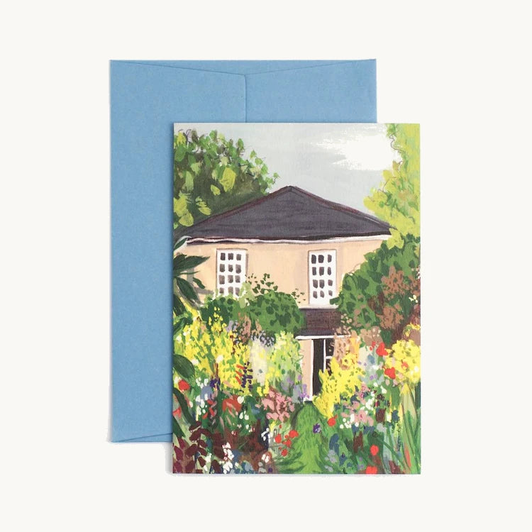 A charming illustrated house and garden greeting card, featuring a colourful English country garden in full bloom, by Peggy & Kate