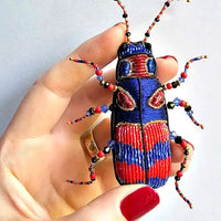 Hand embroidered brooch by French label Céleste Mogador.