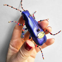Hand embroidered brooch by French label Céleste Mogador.