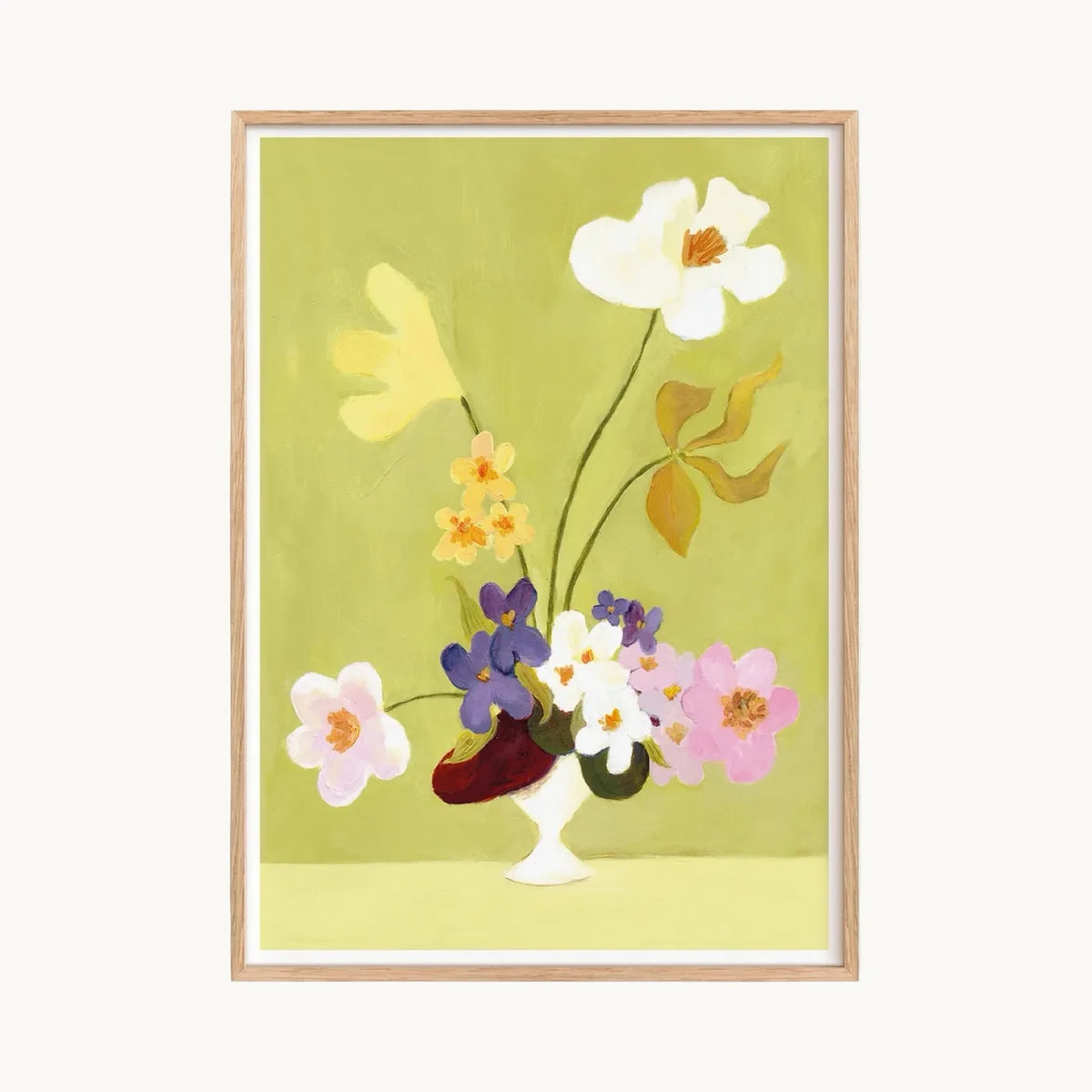 Art print of white, pink, yellow and purple flowers in a small white vase on a lime green background, in an oak frame