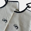 The Voyage Dubai - Adult Bibs - Designed in-house by the team at The Voyage Dubai and sewn by hand locally, these generously-sized, ultra chic adult bibs are finished with a black trim and matching or contrasting embroidery.
Sold in pairs of two. Perfect for date night.