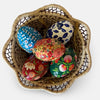 The Voyage Dubai - These decorative Easter eggs are handcrafted and painted by skilled artisans in beautiful kashmiri designs.  Made from willow wood and paper mache and individually painted in an assortment of rich, vibrant colours, they come ready with string for hanging and are finished with a gold tassel adding the final touch.  The perfect addition to your Easter tree or table. 