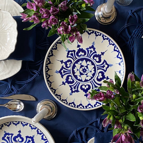 The Voyage Dubai - One of a kind, hand-painted Iznik ceramic plate from Turkey featuring a bold blue and white geometric design.