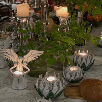 The Voyage Dubai - White Angel Candle Holder.  These charming white angel candle holders add a festive touch to your dining table or mantlepiece. Handmade by Zimbabwean artists 'Bro’s at the Ro', they are stunning on their own or even more lovely when grouped together.