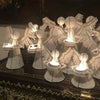 The Voyage Dubai - White Angel Candle Holder.  These charming white angel candle holders add a festive touch to your dining table or mantlepiece. Handmade by Zimbabwean artists 'Bro’s at the Ro', they are stunning on their own or even more lovely when grouped together.