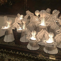 The Voyage Dubai - White Angel Candle Holder.  These charming white angel candle holders add a festive touch to your dining table or mantlepiece. Handmade by Zimbabwean artists 'Bro’s at the Ro', they are stunning on their own or even more lovely when grouped together.