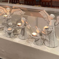 The Voyage Dubai - White Angel Candle Holder.  These charming white angel candle holders add a festive touch to your dining table or mantlepiece. Handmade by Zimbabwean artists 'Bro’s at the Ro', they are stunning on their own or even more lovely when grouped together.