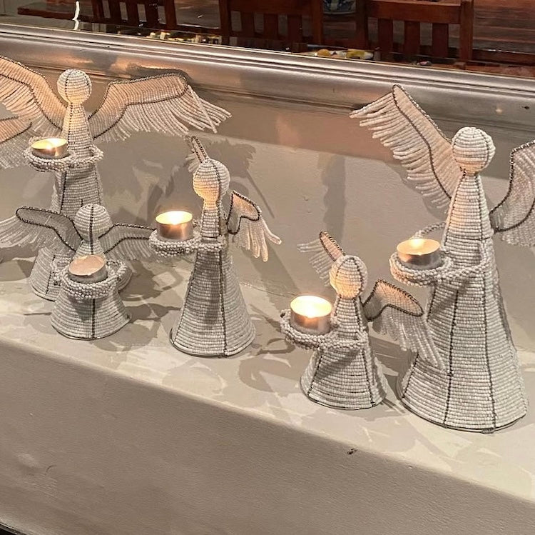 The Voyage Dubai - White Angel Candle Holder.  These charming white angel candle holders add a festive touch to your dining table or mantlepiece. Handmade by Zimbabwean artists 'Bro’s at the Ro', they are stunning on their own or even more lovely when grouped together.