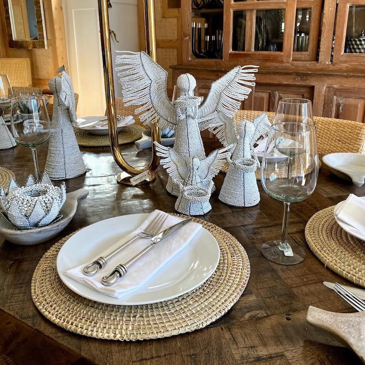 The Voyage Dubai - White Angel Candle Holder.  These charming white angel candle holders add a festive touch to your dining table or mantlepiece. Handmade by Zimbabwean artists 'Bro’s at the Ro', they are stunning on their own or even more lovely when grouped together.