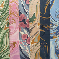 The Voyage Dubai - These paper sheets are each individually hand marbled by skilled artisans on to luxurious cotton handmade papers. They are not screen printed or digitally mass-produced.
The beautiful free-flowing hand marbled designs are suitable for any occasion and are also popular choice for art and craft, origami and bookbinding.
