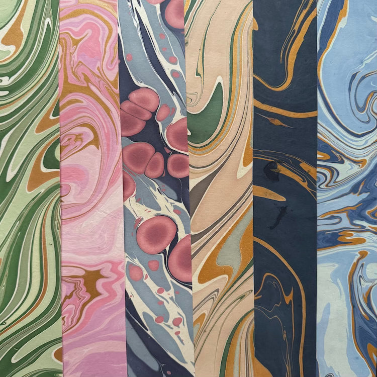 The Voyage Dubai - These paper sheets are each individually hand marbled by skilled artisans on to luxurious cotton handmade papers. They are not screen printed or digitally mass-produced.
The beautiful free-flowing hand marbled designs are suitable for any occasion and are also popular choice for art and craft, origami and bookbinding.