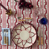 The Voyage Dubai - Mallorcan Ikat Tablecloth in Raspberry Ribbon. A striking cotton blend tablecloth printed in this traditional geometric motif reflective of the easy Mediterranean lifestyle. Perfect for long lunches and alfresco dining.