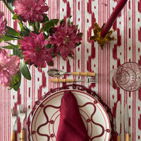 The Voyage Dubai - Mallorcan Ikat Tablecloth in Raspberry Ribbon. A striking cotton blend tablecloth printed in this traditional geometric motif reflective of the easy Mediterranean lifestyle. Perfect for long lunches and alfresco dining.