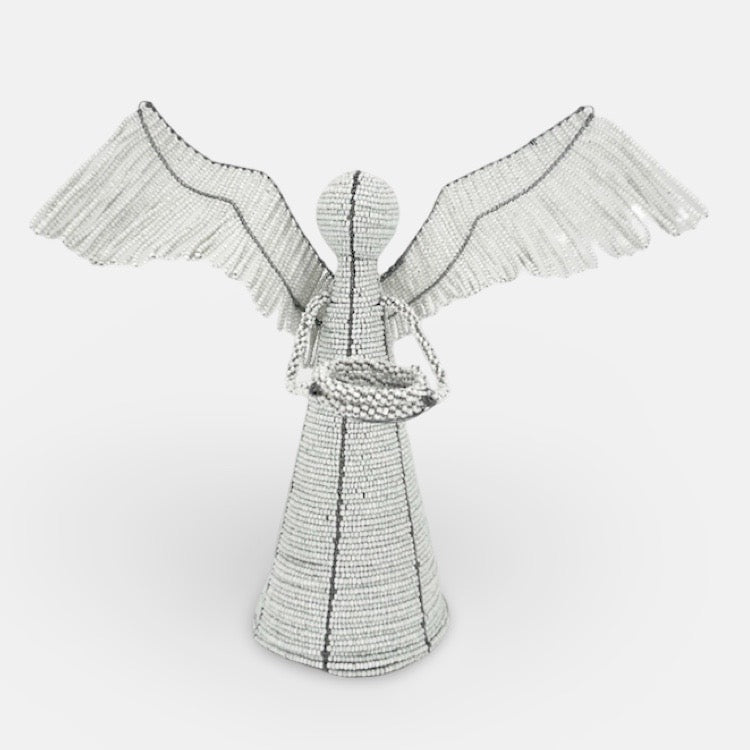 The Voyage Dubai - White Angel Candle Holder.  These charming white angel candle holders add a festive touch to your dining table or mantlepiece. Handmade by Zimbabwean artists 'Bro’s at the Ro', they are stunning on their own or even more lovely when grouped together.