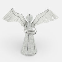 The Voyage Dubai - White Angel Candle Holder.  These charming white angel candle holders add a festive touch to your dining table or mantlepiece. Handmade by Zimbabwean artists 'Bro’s at the Ro', they are stunning on their own or even more lovely when grouped together.