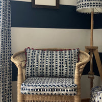 A striking accent cushion crafted from Volga Linen's Kitezh print in Prussian Blue finished with a red trim and concealed zip.