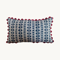 A striking accent cushion crafted from Volga Linen's Kitezh print in Prussian Blue finished with a red trim and concealed zip.