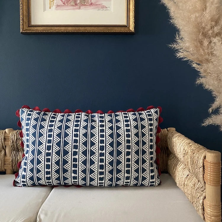 A striking accent cushion crafted from Volga Linen's Kitezh print in Prussian Blue finished with a red trim and concealed zip.