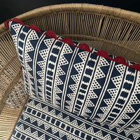A striking accent cushion crafted from Volga Linen's Kitezh print in Prussian Blue finished with a red trim and concealed zip.
