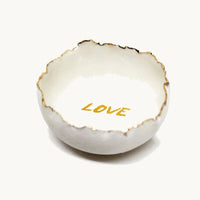 Handmade in a small studio in Notting Hill by Heidi Bishop, this stunning porcelain 'jagged' bowl features a delicate hand painted LOVE and is finished with gold edging.