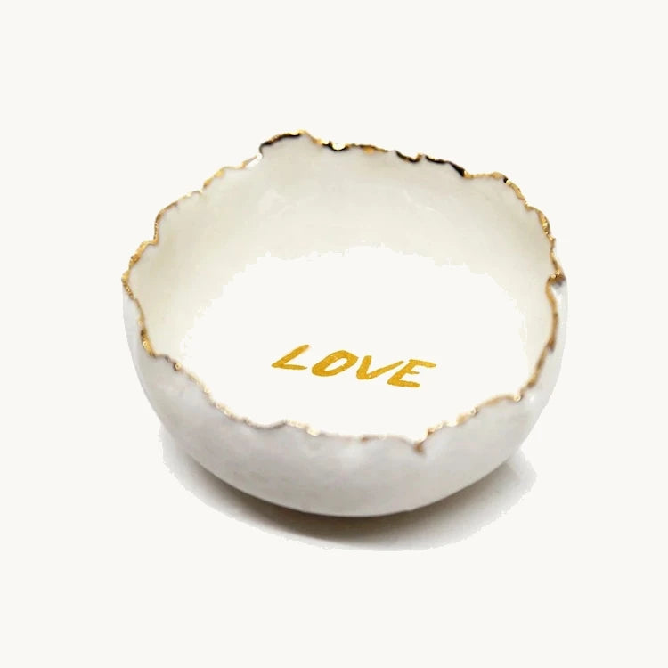 Handmade in a small studio in Notting Hill by Heidi Bishop, this stunning porcelain 'jagged' bowl features a delicate hand painted LOVE and is finished with gold edging.