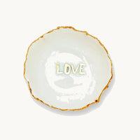Handmade in a small studio in Notting Hill by Heidi Bishop, this stunning porcelain 'jagged' bowl features a delicate hand painted LOVE and is finished with gold edging.