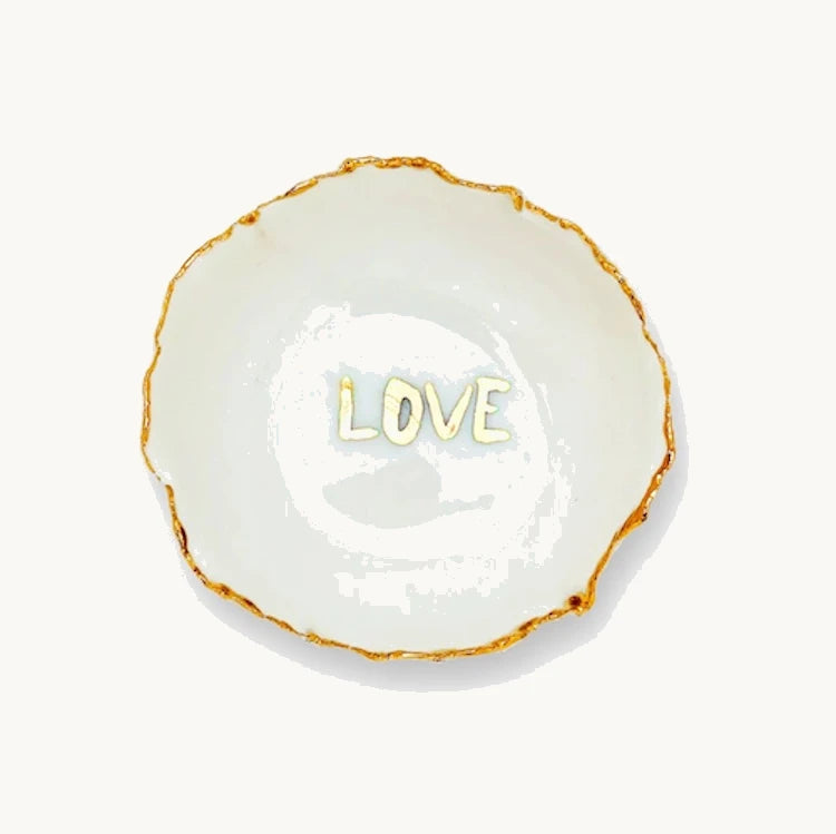 Handmade in a small studio in Notting Hill by Heidi Bishop, this stunning porcelain 'jagged' bowl features a delicate hand painted LOVE and is finished with gold edging.
