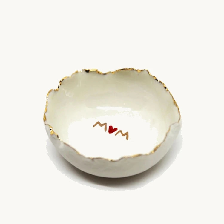 Handmade in a small studio in Notting Hill by Heidi Bishop, this stunning porcelain 'jagged' bowl features a delicate hand painted MUM and is finished with gold edging.