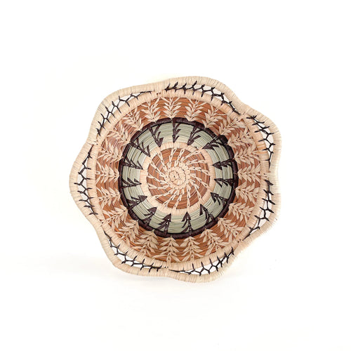 The Voyage Dubai - Handmade by skilled artisans in Guatemala, the Margarita basket is a wonderful tabletop accent. It has been delicately handwoven from a combination of native grass and pine needles in neutral colours and has a scalloped rim.   Handmade and fair trade.