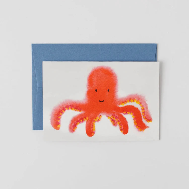 A cheerful greeting card featuring a friendly coral octopus by Peggy & Kate