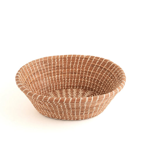 The Voyage Dubai - Handmade by skilled artisans in Guatemala, the Rosa basket is delicately handwoven from native grass and pine needles with raffia accents. Functional as well as beautiful, the Rosa is perfect as a bread basket or decorative piece.  Handmade and fair trade.
