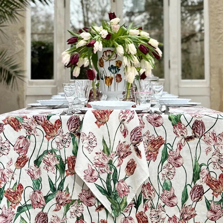 A table set with the S&B Tulip Linen Tablecloth and Napkins in Red & Pink