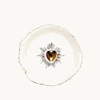 Handmade and hand painted in a small studio in Notting Hill by Heidi Bishop, this stunning porcelain bowl features an incised red 'Sacred Heart' with delicate hand painted gold edging.